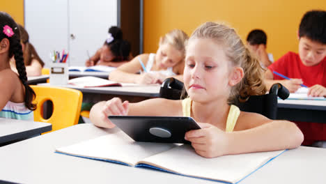 Schoolgirl-using-digital-tablet-in-classroom