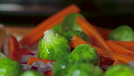 Pouring-oil-over-fresh-vegetables-before-cooking