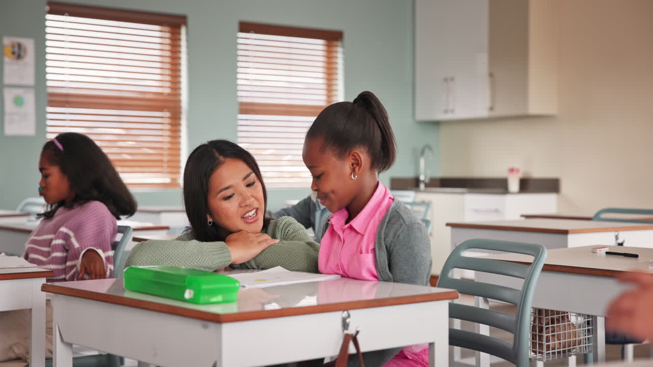 Teacher helping student in classroom