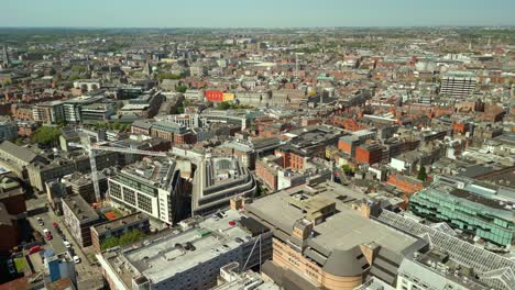 ultra-wide, forward travelling aerial of the dublin city skyline in dublin, county leinster, ireland on a bright and sunny day. filmed in 4k, 60fps and with rec709 color.