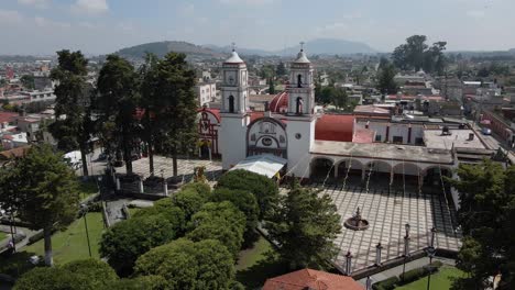 drone shot rotating over the main square, the atrial cross, the convent and the municipal palace in almoloya, mexico city