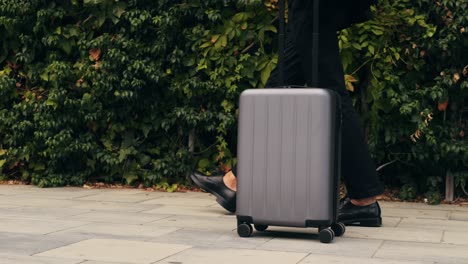 Tourist man with suitcase baggage in spain, A traveler with luggage suit jacket on business street go to a hotel, business office, airport terminal, enjoying the vibrant atmosphere