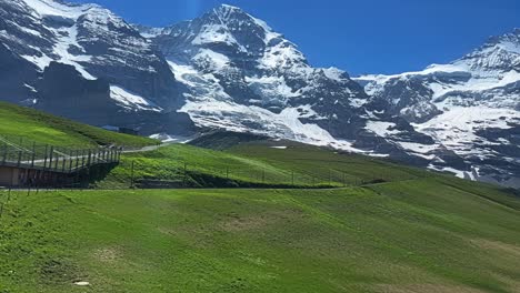 picturesque of hotel and railway at klein scheidegg with mountainous background in bernese oberland, switzerland