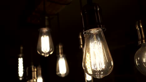 vintage style light bulbs hanging from the ceiling. old light bulb.