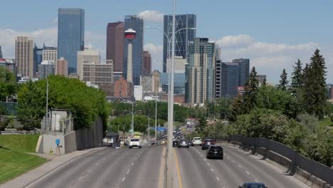 traffic time-lapse with modern city centre in the background