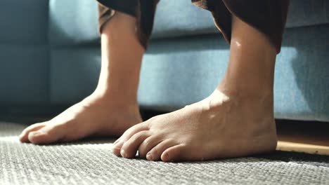 barefoot legs on sofa