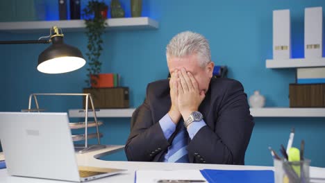sick businessman sneezing.