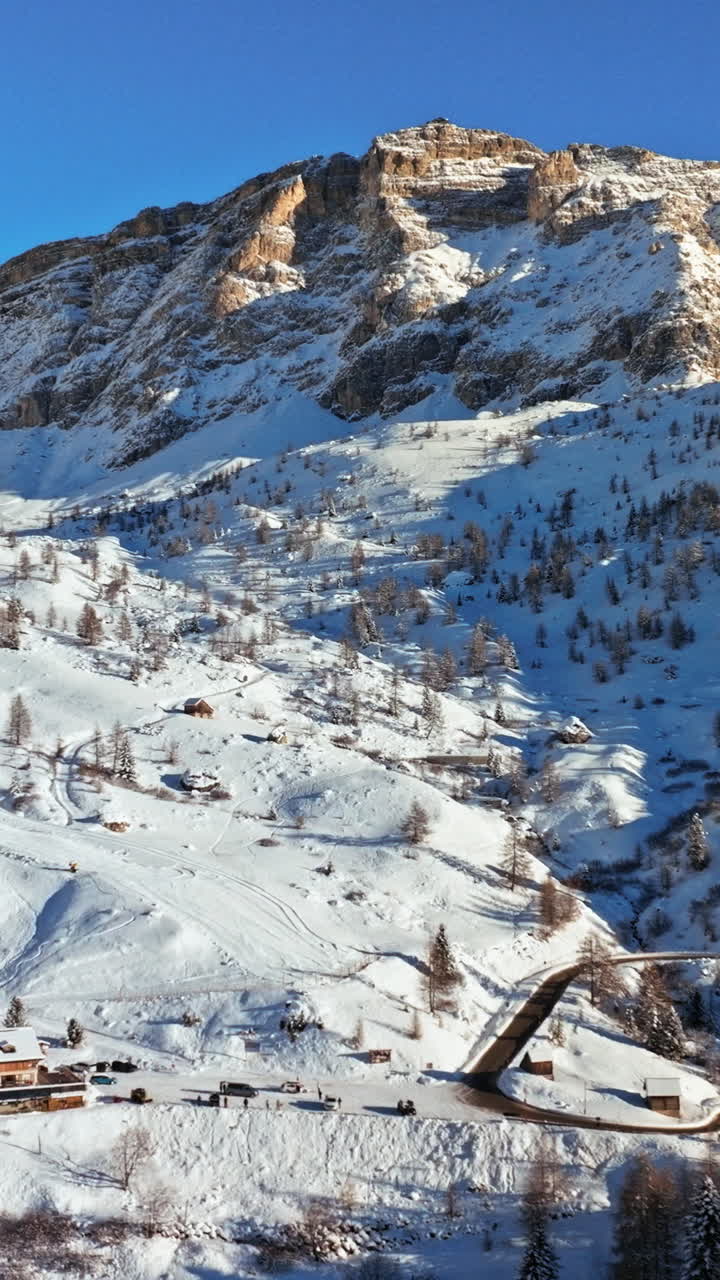 Aerial drone view of the Giau Pass high mountain pass in the Dolomites, Italy. Vertical