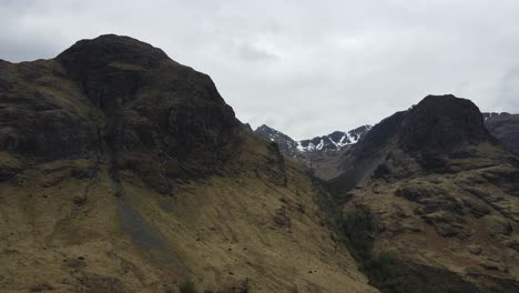 ethereal atmosphere that shroud the the three sisters of glen coe adding mystique and enhancing the overall grandeur of the panoramic view