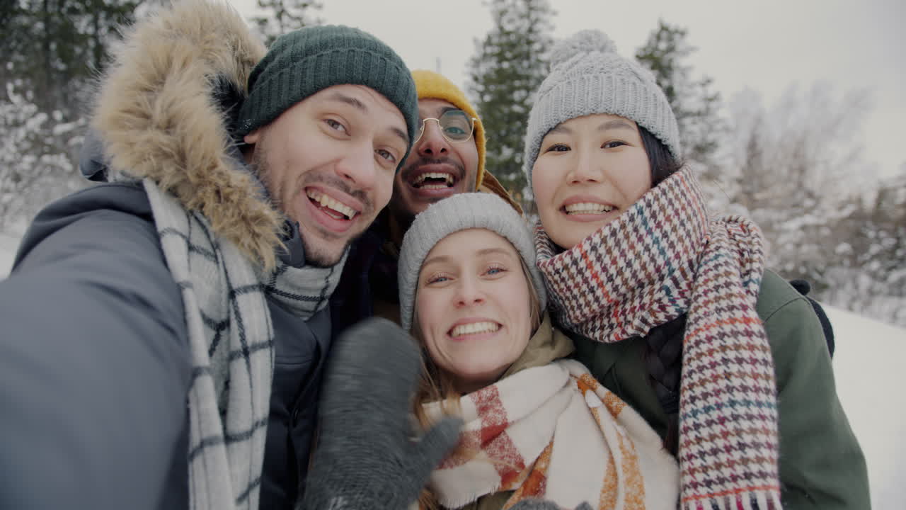 Happy Friends Taking a Selfie in the Snow
