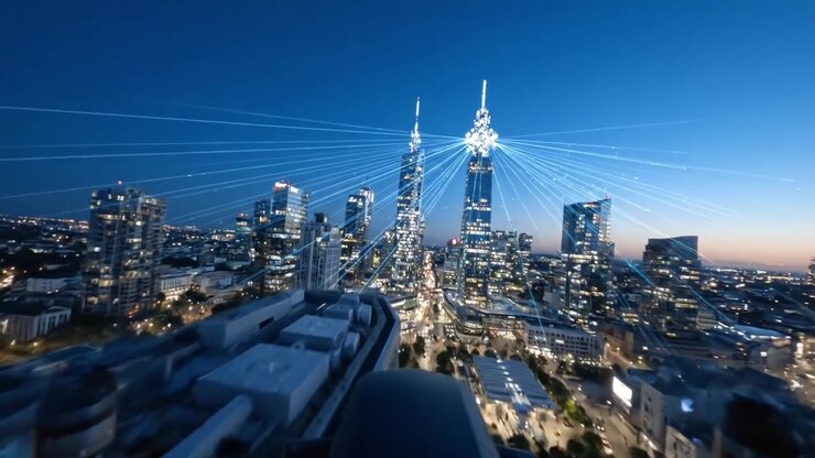 Una vista mozzafiato di uno skyline cittadino vibrante al tramonto, che mostra moderni grattacieli illuminati contro il cielo serale con fasci di luce che si irradiano verso l'esterno.