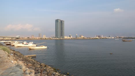 ras al khaimah, united arab emirates north of dubai, pan along the corniche on a partly cloudy winter day..