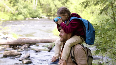 Family-observing-the-views-at-the-river