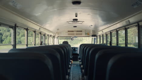 interior empty school bus closeup. rows seats inside safety public transport.