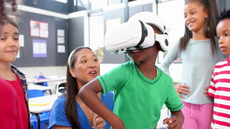 in school, children using vr headset with teacher guiding in classroom activity
