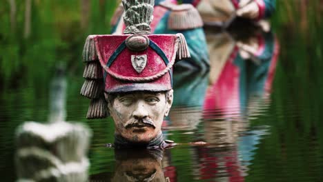 Detailed-view-of-old-soldier-statue-deep-water,-static-view