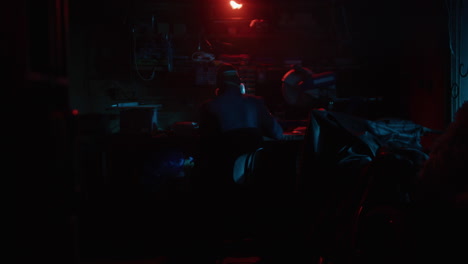 person working in a dark garage