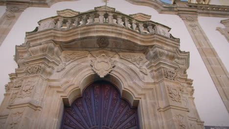 girl looking at church of mercy facade in viseu portugal slow motion