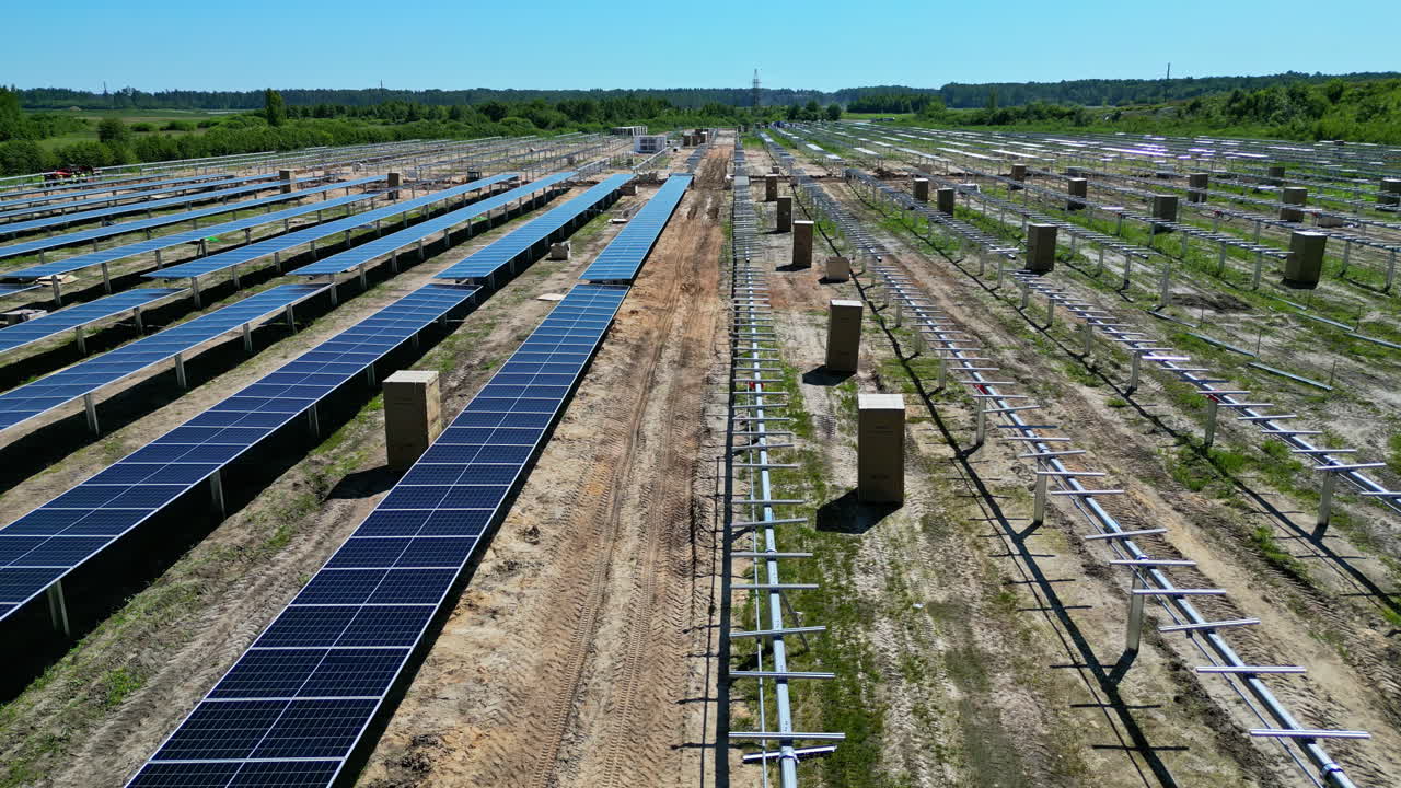 Expansive Solar Farm under construction with Clear Sky above