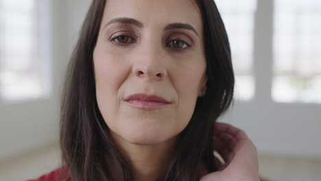 close-up-portrait-of-elegant-woman-looking-series-pensive-at-camera-running-hand-through-hair-independent-womanhood