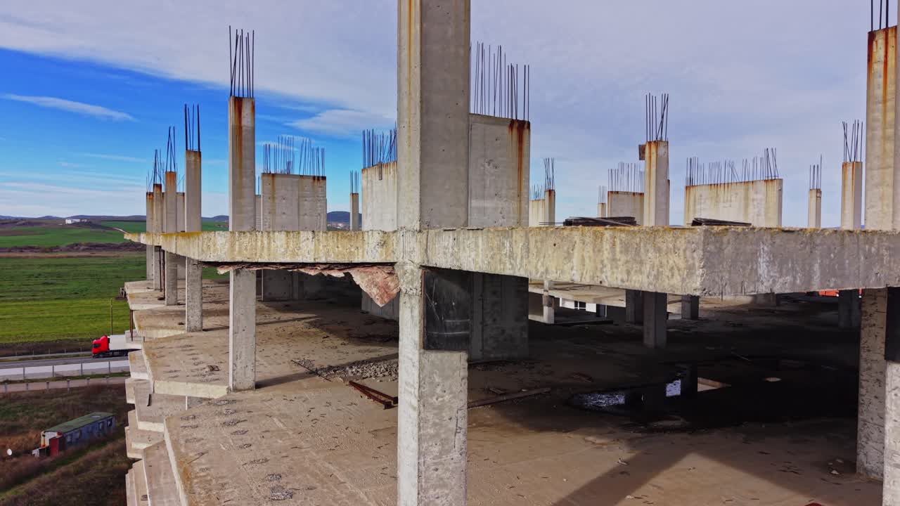 Aerial view of an unfinished concrete building under construction