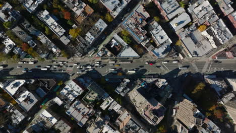 Aerial-birds-eye-overhead-top-down-panning-view-of-traffic-on-multilane-one-way-street-in-West-Village-borough.-Manhattan,-New-York-City,-USA