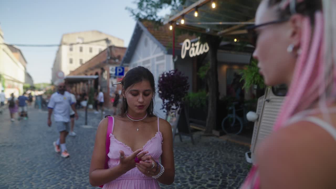 Two Stylish Women Chatting at a Flower Shop