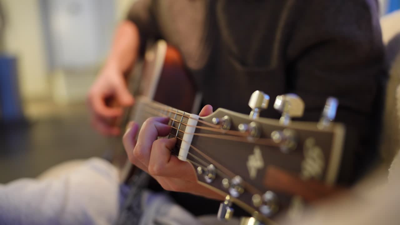 Playing guitar as a hobby cinematic shot