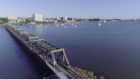 Old-steel-Matapihi-railroad-bridge-of-Tauranga-in-bay-of-plenty,-aerial