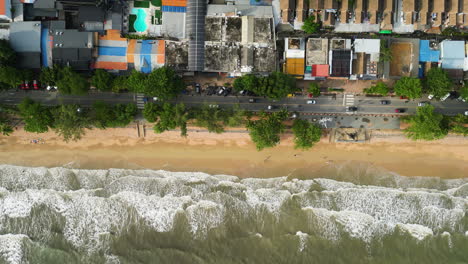 Ao-Nang-coastline-with-main-street,-top-down-view-on-beach-and-traffic