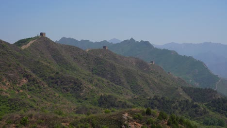 mountainous view of the jinshanling section with lush greenery and serene setting. great wall, china
