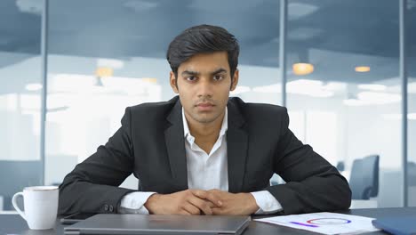 Angry-Indian-businessman-staring-at-the-camera