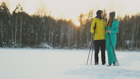 family skiers spend the weekend together doing skiing in the woods. healthy lifestyle. slow motion. loving couple