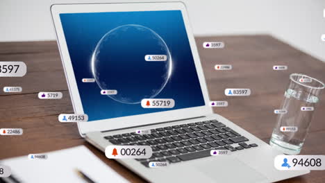 animation of social media icons and numbers over laptop