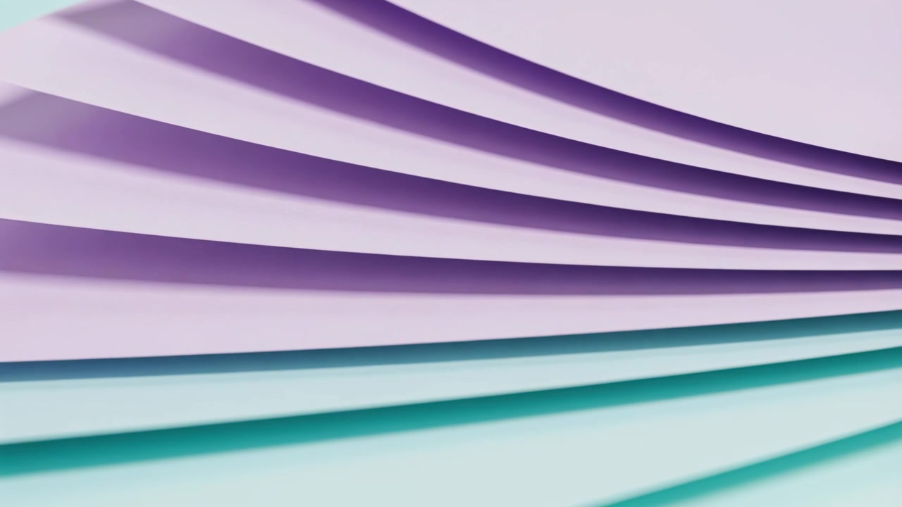 Panning camera, stacked curved lavender and teal sheets shifting down in studio, showing layers