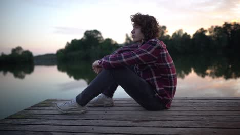 Young-man-at-lake-thinking-about-life