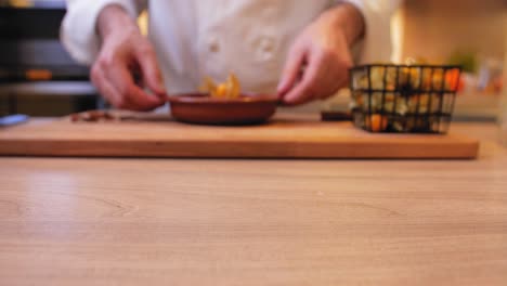 the chef puts the pudding on the tabletop