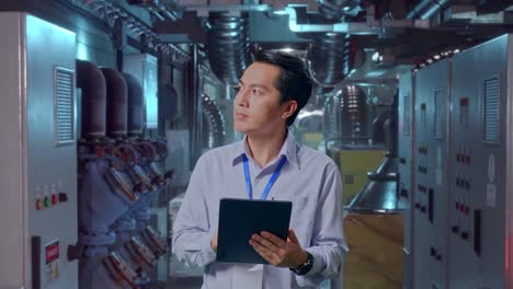 engineer reviewing operations in industrial facility