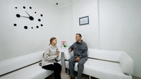 modern medical office waiting room with patients
