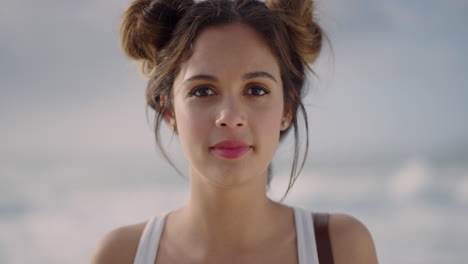 portrait-of-beautiful-young-hispanic-woman-looking-calm-pensive-at-camera-on-seaside-background