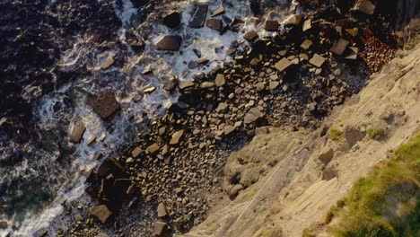 Vertiginous-aerial-top-down-over-the-edge-of-Cliffs,-in-Moher