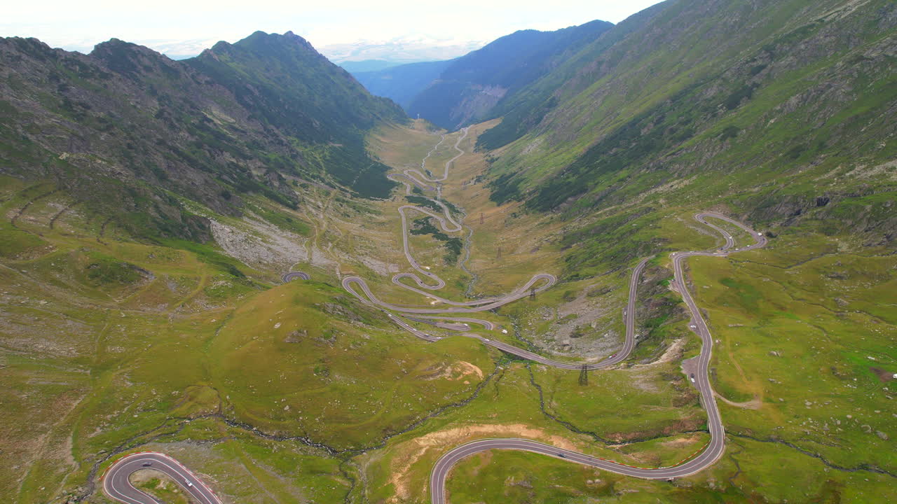 Winding Transfagarasan Alpine Road in Romania. Aerial tilt-up view