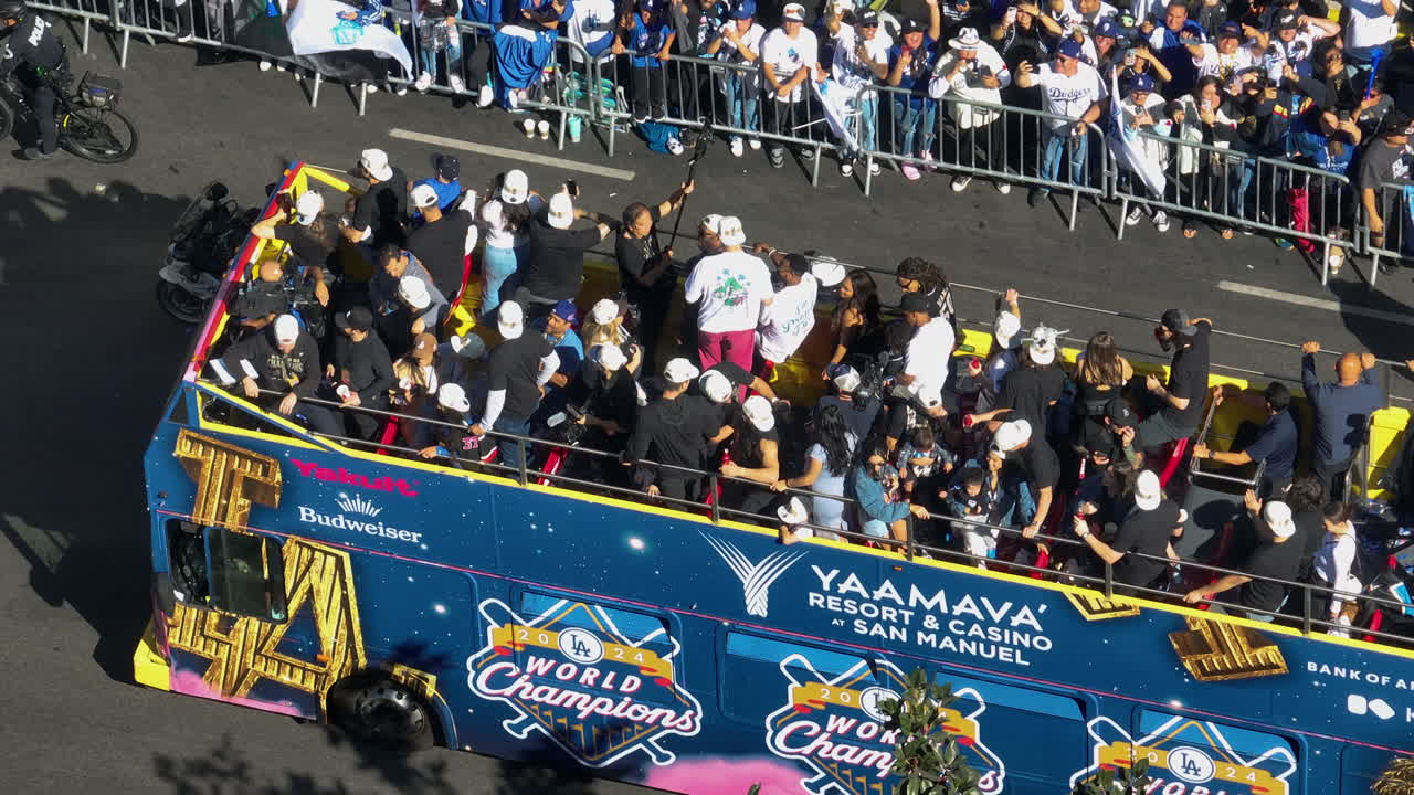 Telephoto aerial of players celebrating on a bus at the Dodgers parade in LA