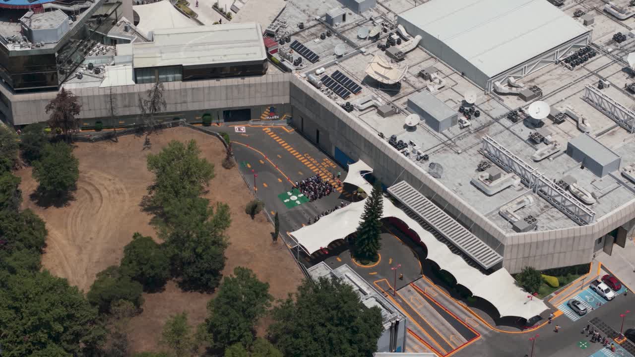 Drone view of people evacuating in a drill