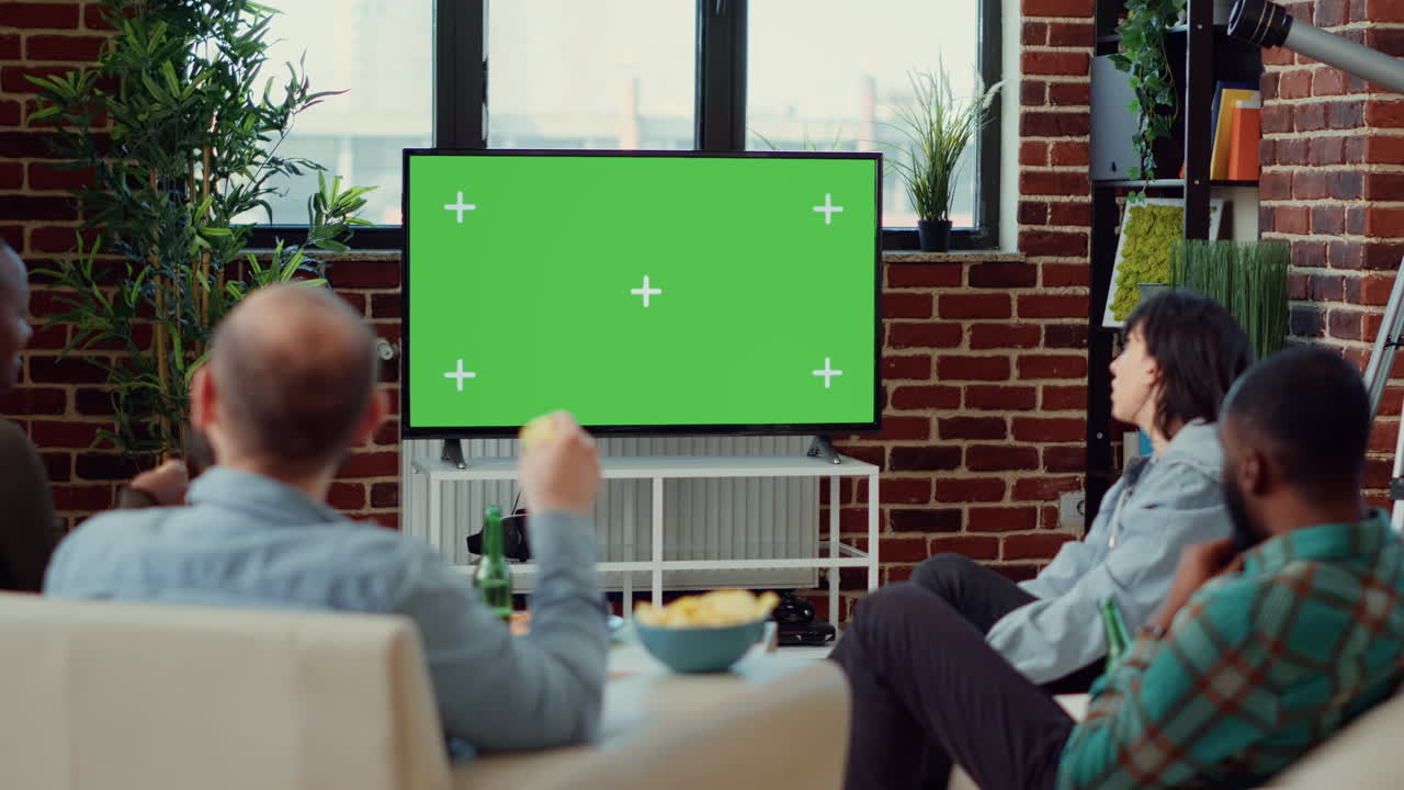 Multiethnic group of friends looking at greenscreen