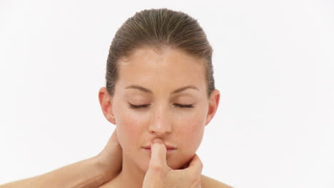 young woman lying receving a head massage