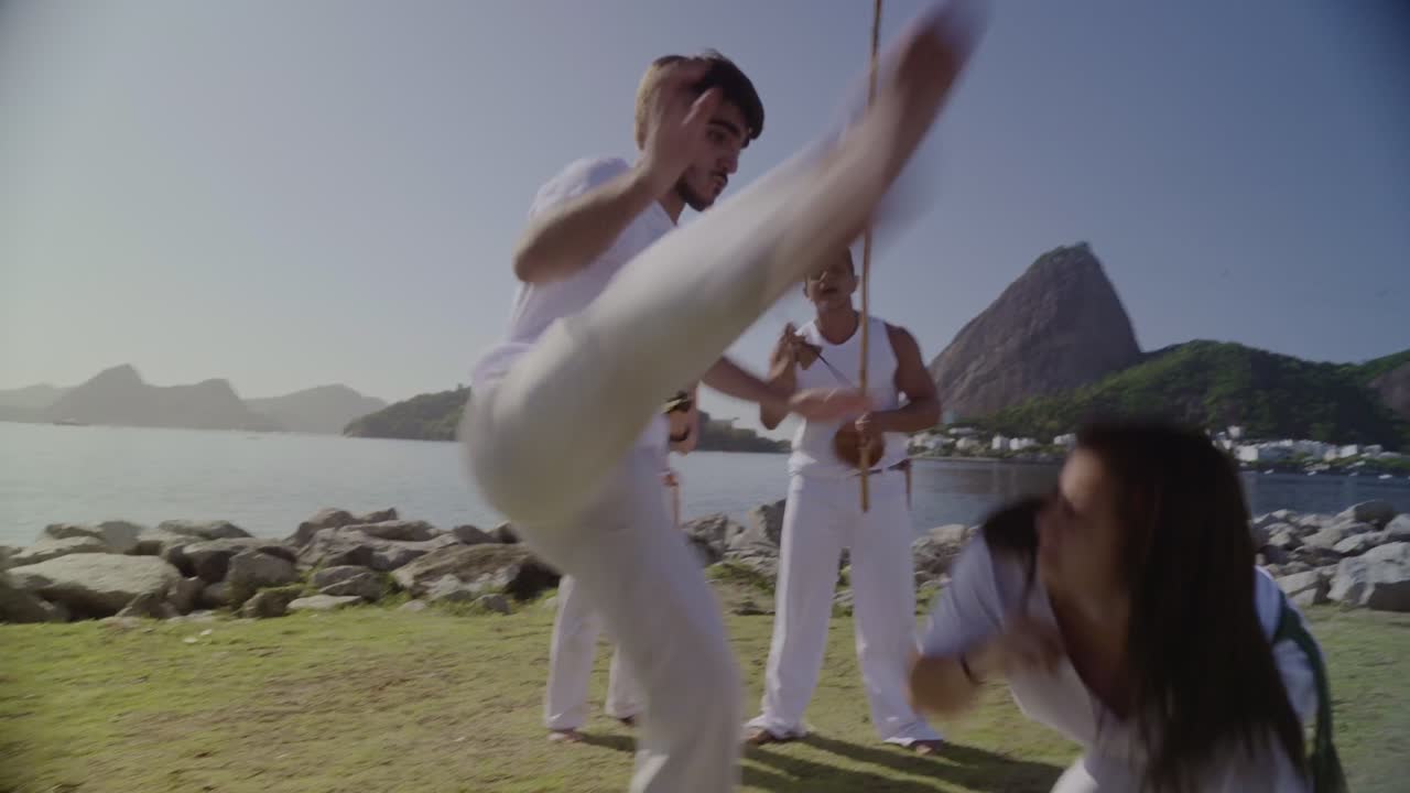 People practicing Capoeira outdoors in Rio de Janeiro