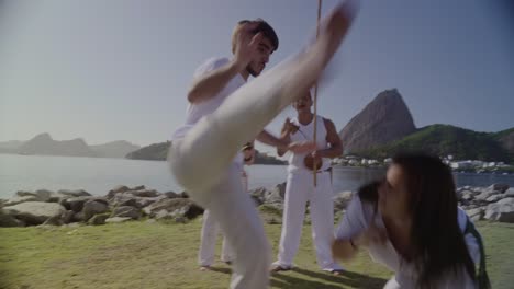 people practicing capoeira outdoors in rio de janeiro