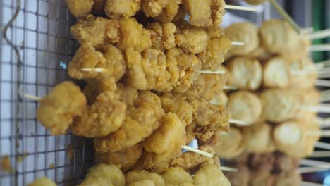fried chicken and balls on sticks