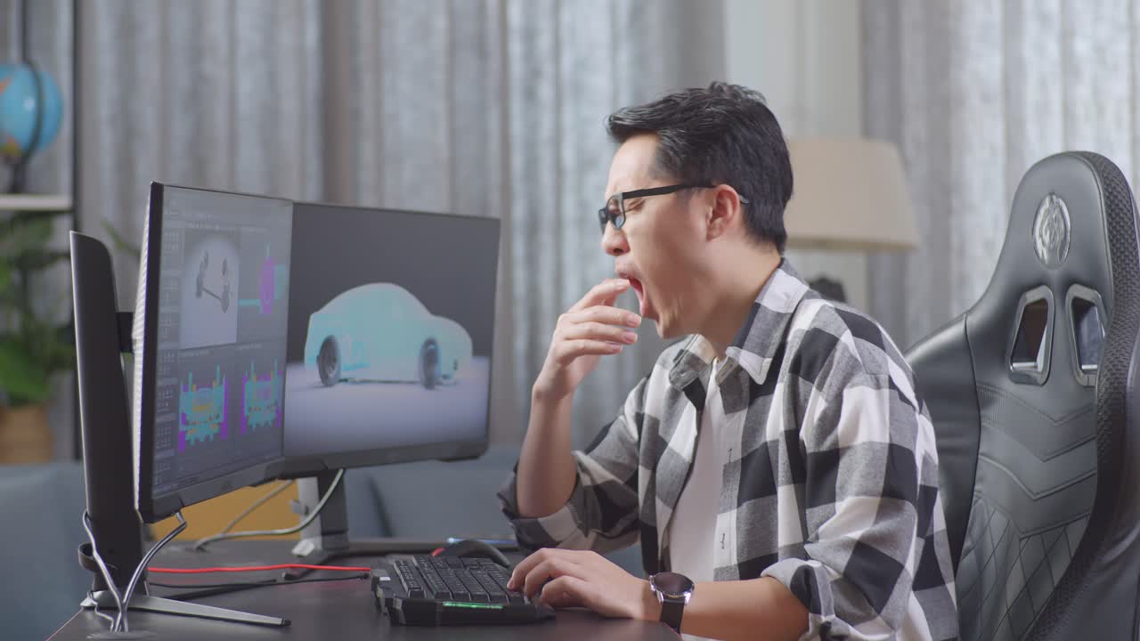 피곤한 디자이너가 3d 모델을 만들고 있습니다.